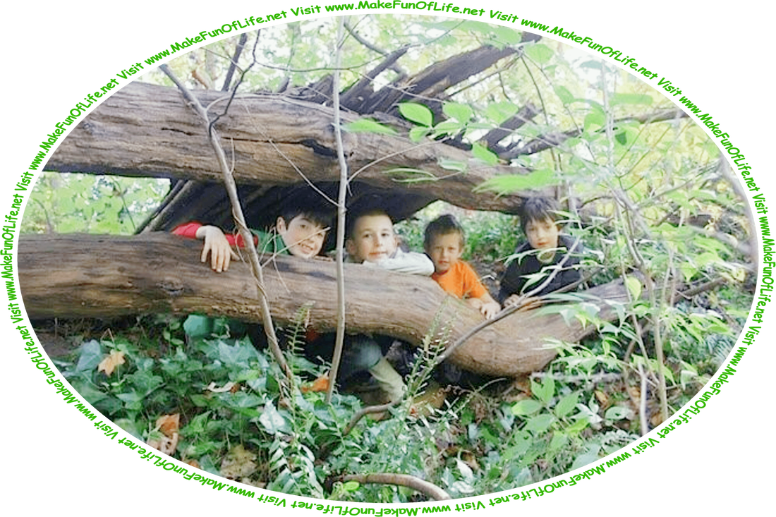 Picture of four happy smiling boys a woods with green leafy trees and other plants, and the words, ‘Visit www.MakeFunOfLife.net.’